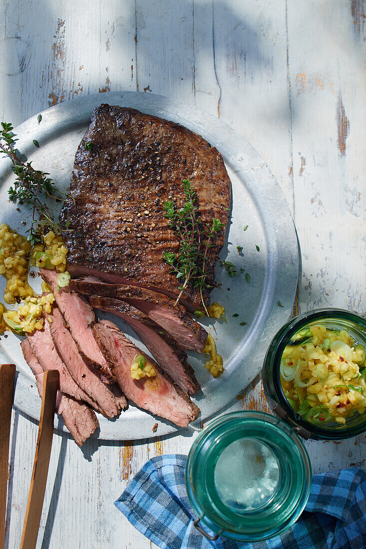Smoked flank steak with pineapple and chili salsa