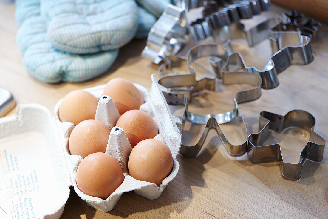 Eggs in a carton and cookie cutters