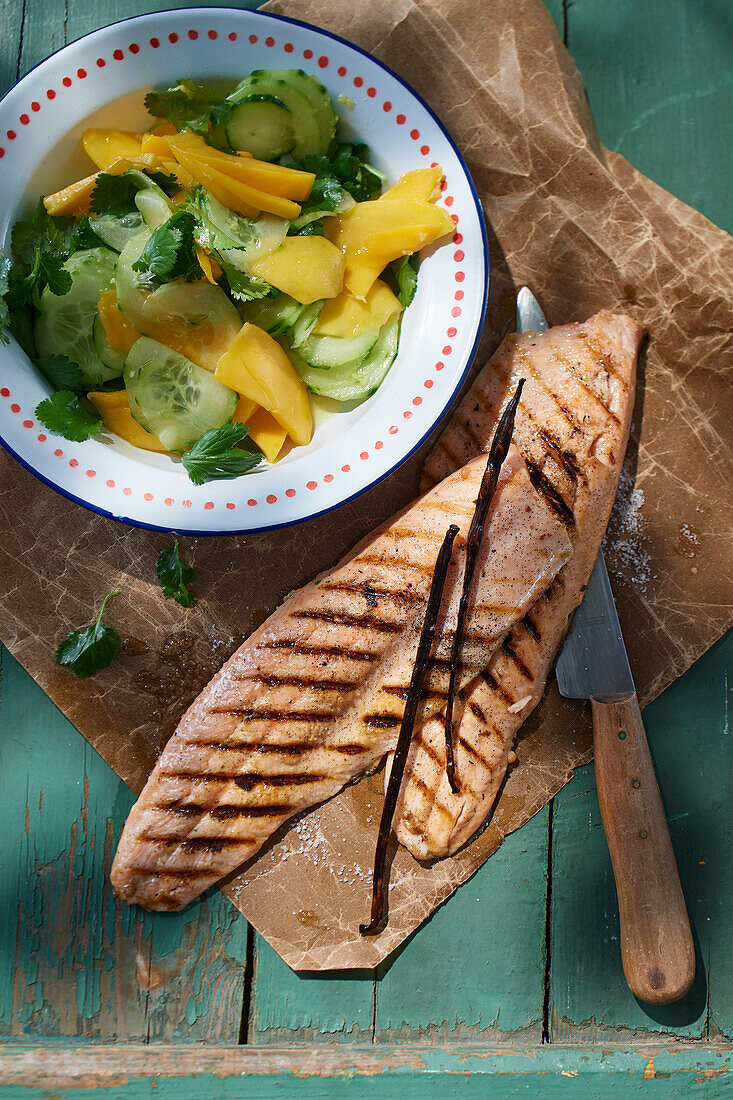 Grilled char fillet with mango and cucumber salad