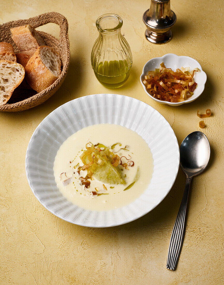 Crème vichyssoise with herb oil and leek