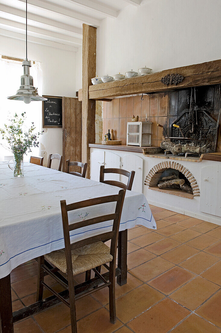 Large country house kitchen with open fireplace