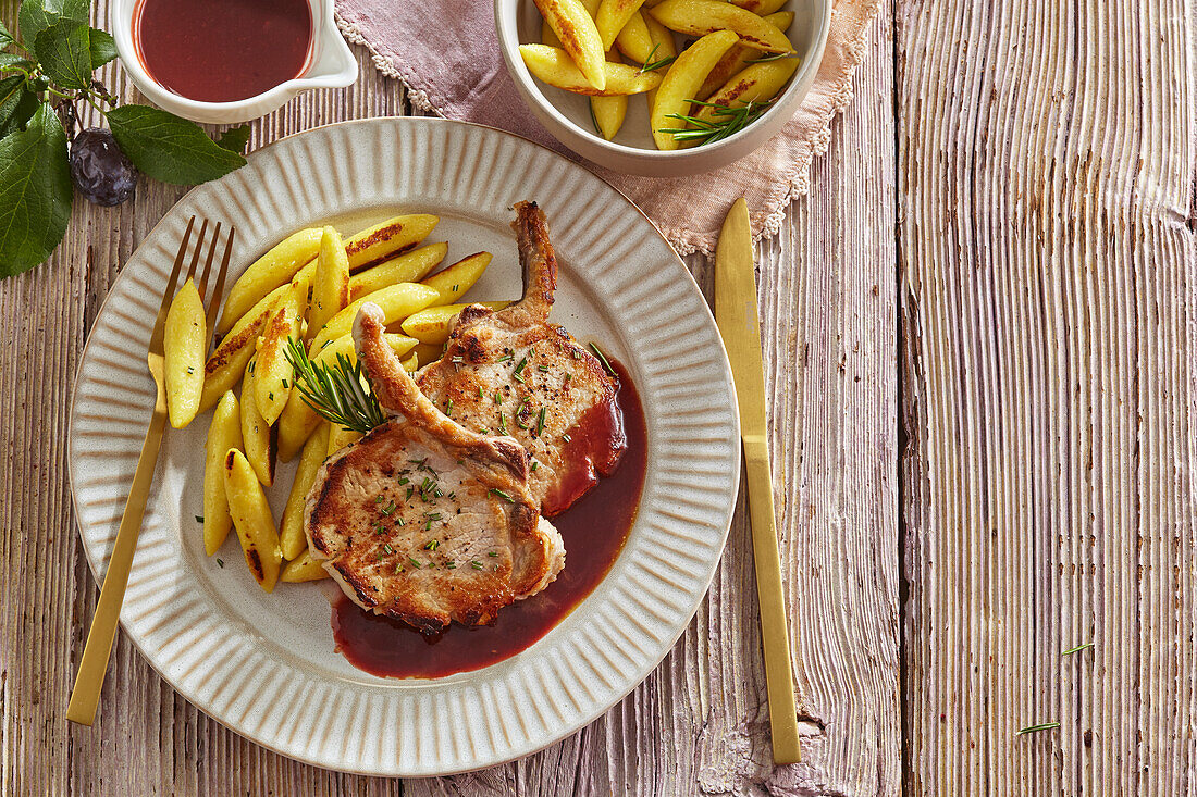 Roasted pork chops with plum sauce and potato noodles