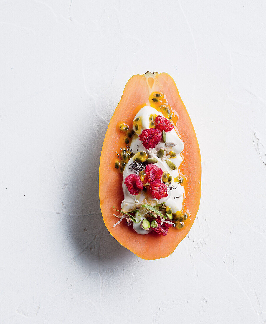 Papaya breakfast boat with coconut yogurt and fruit