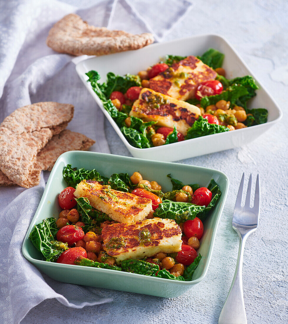 Grilled halloumi cheese with roasted vegetables and pesto