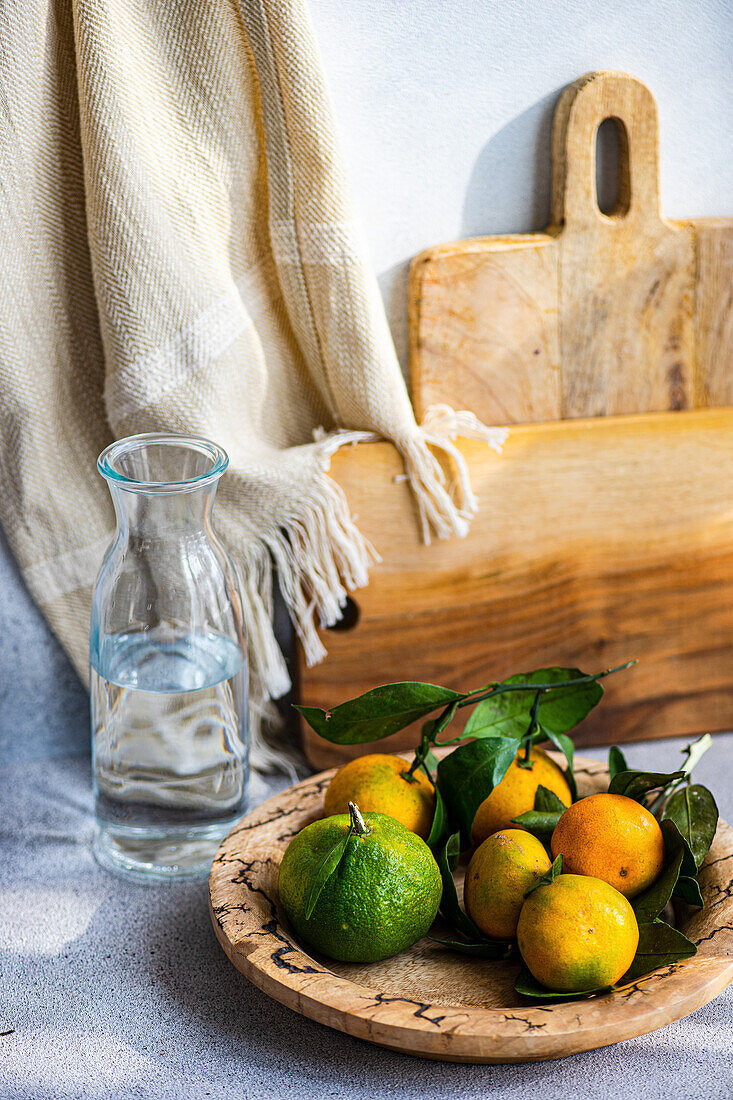 Rustic table decoration with wooden boards and fresh citrus fruits