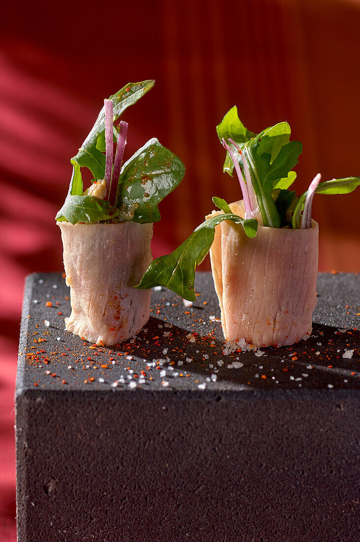 Beef sushi with rocket salad