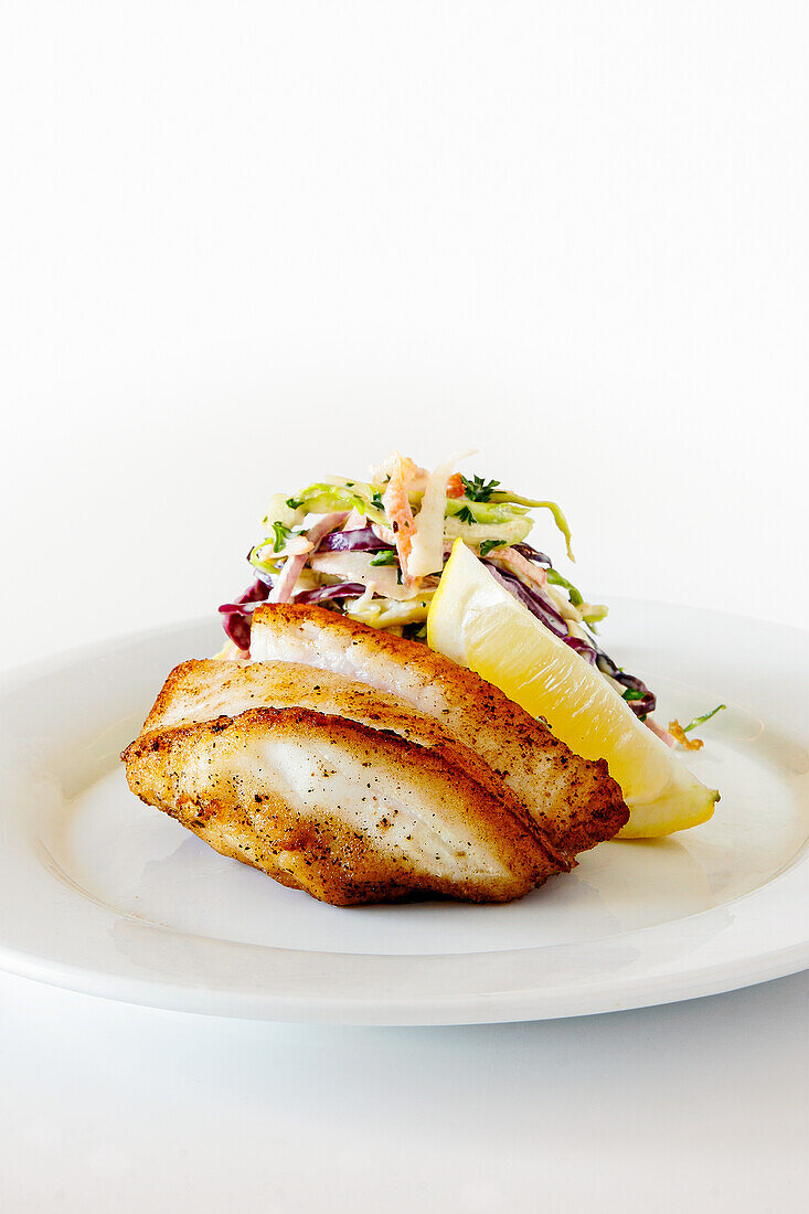 Fried fish fillet with coleslaw