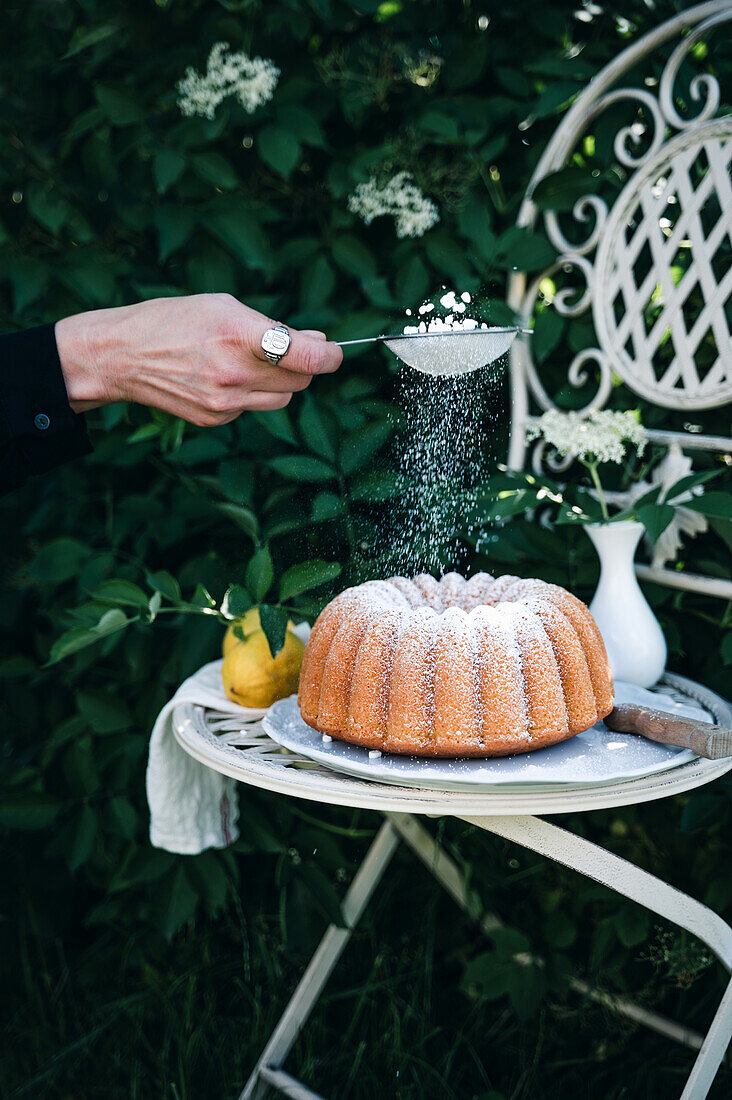 Vegan elderflower bundt cake with powdered sugar