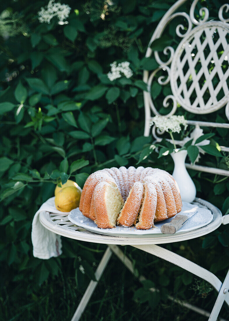 Vegan elderflower bundt cake with icing sugar