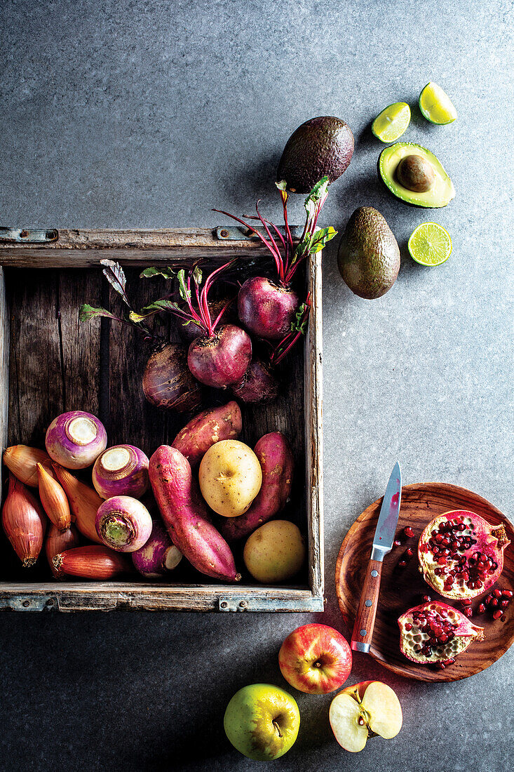 Winter vegetables - beetroot, avocado, pomegranate, and potatoes