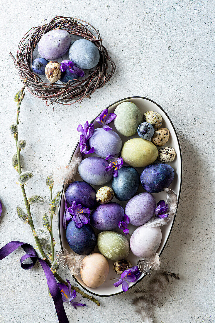 Naturally colored Easter eggs with blueberries, spinach and beetroot