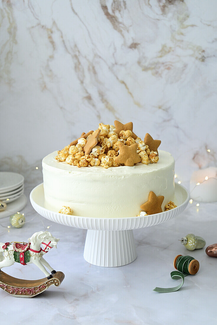 Caramel and honey cake with sour cream, decorated with cookies and popcorn