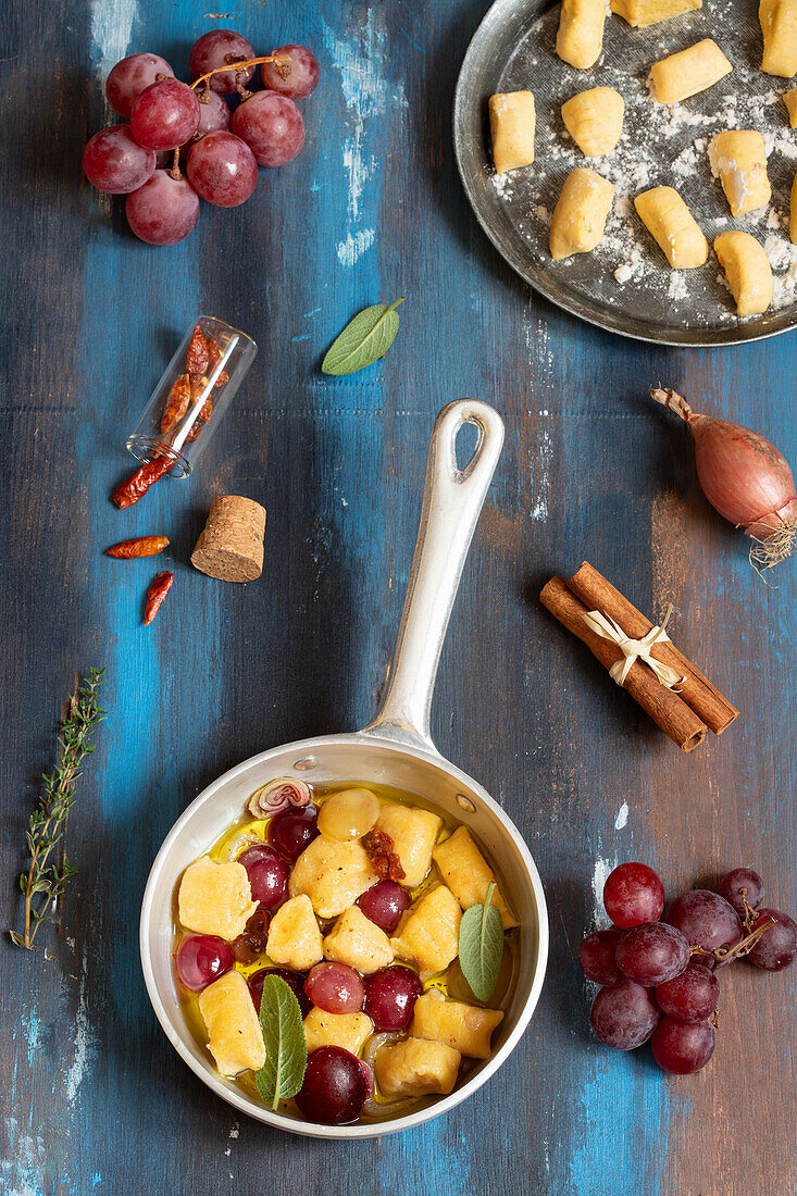 Ricotta and carrot gnocchi with grapes, chilies and shallots