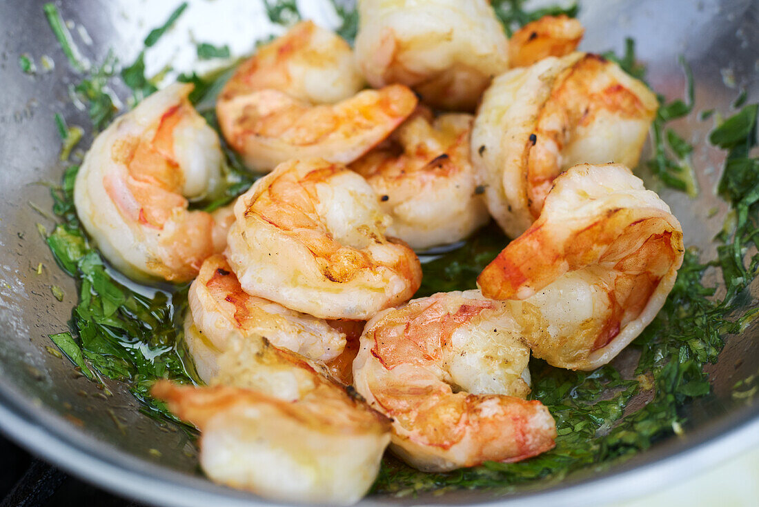 Marinate shelled prawns in oil and herbs