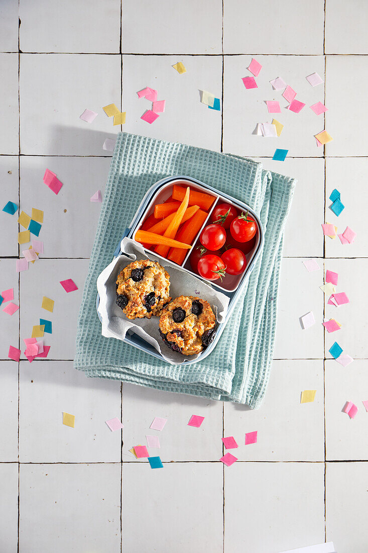 Vegan blueberry and oat muffins in lunch box for snack