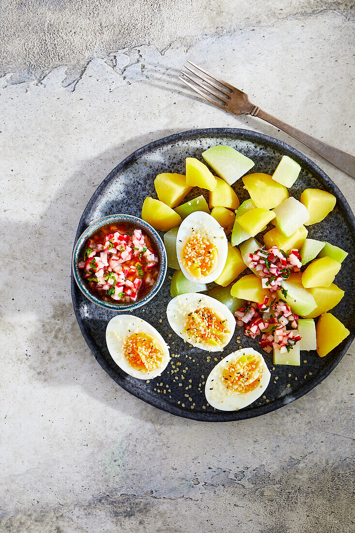 Potato and kohlrabi vegetables with radish salsa and eggs