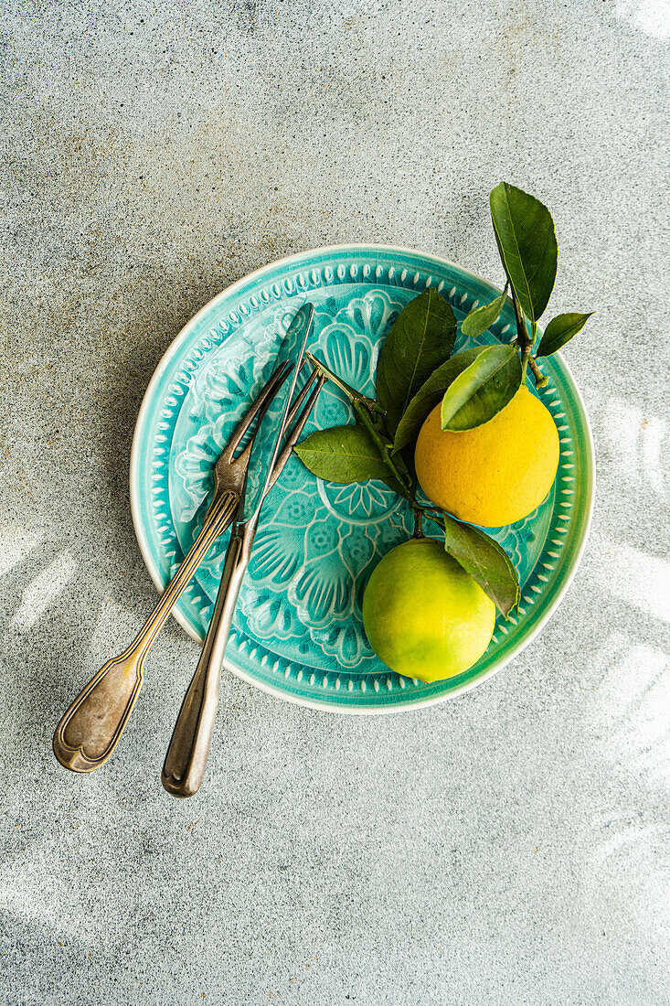 Place setting with citrus fruits