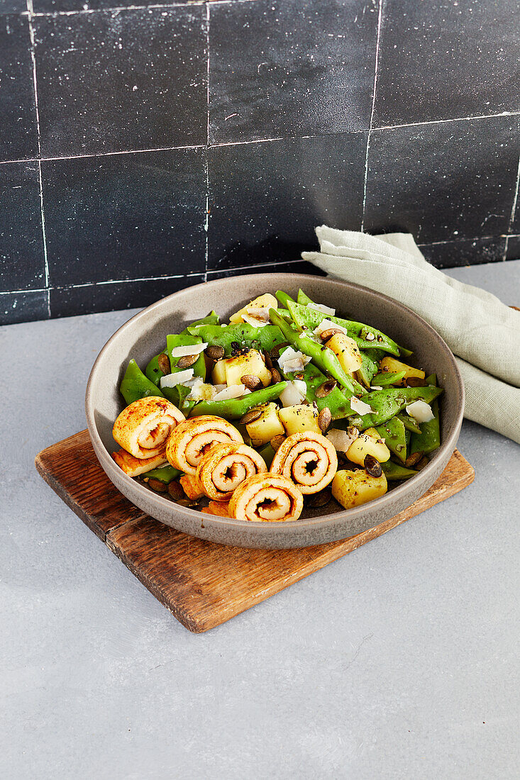 Potato and bean salad with Parmesan omelet rolls