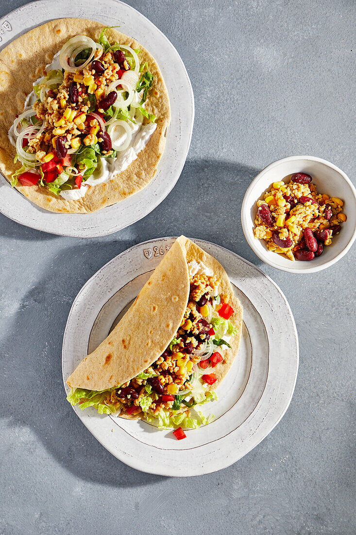 Vegan tacos with soya shreds, vegetables and soya cream