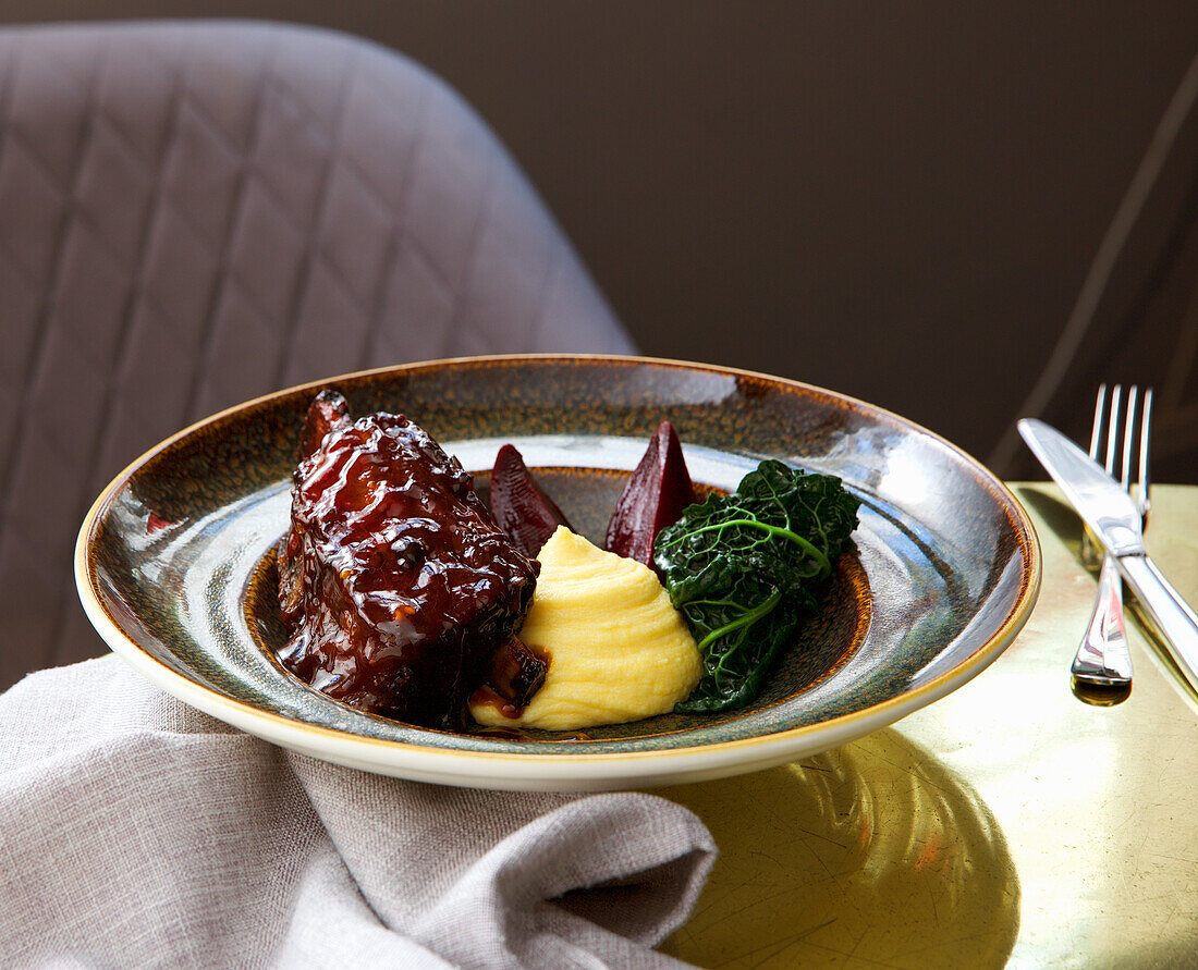 Braised beef rib with mashed potatoes and savoy cabbage