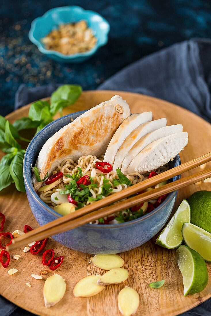 Fried chicken breast with Asian noodles