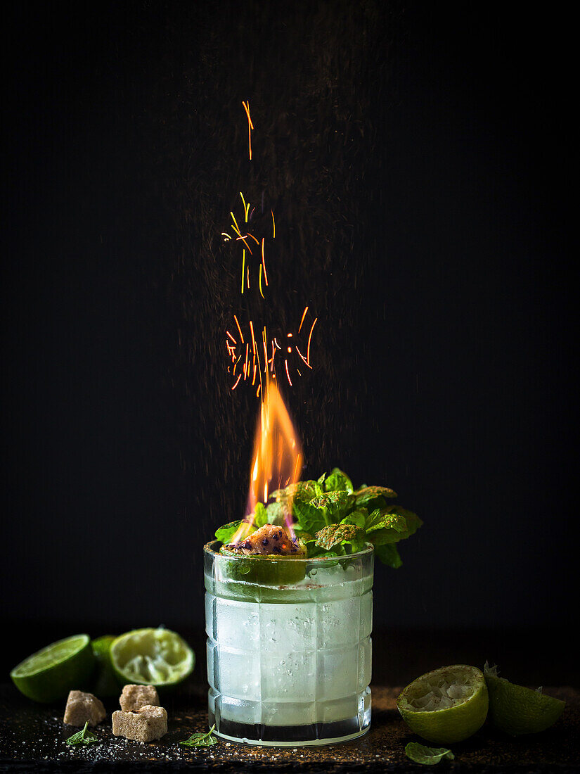 Cocktail with burning sugar cubes