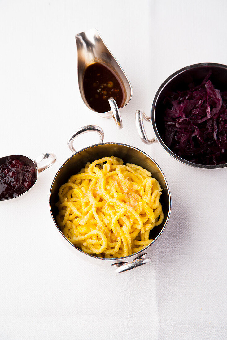 Side dishes with roast - gravy, spaetzle, red cabbage, cranberries