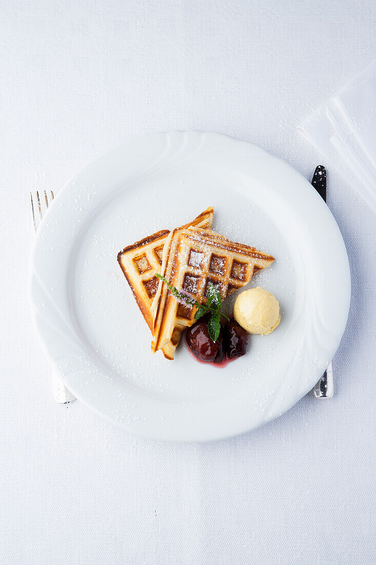 Waffles with vanilla ice cream and pickled plums