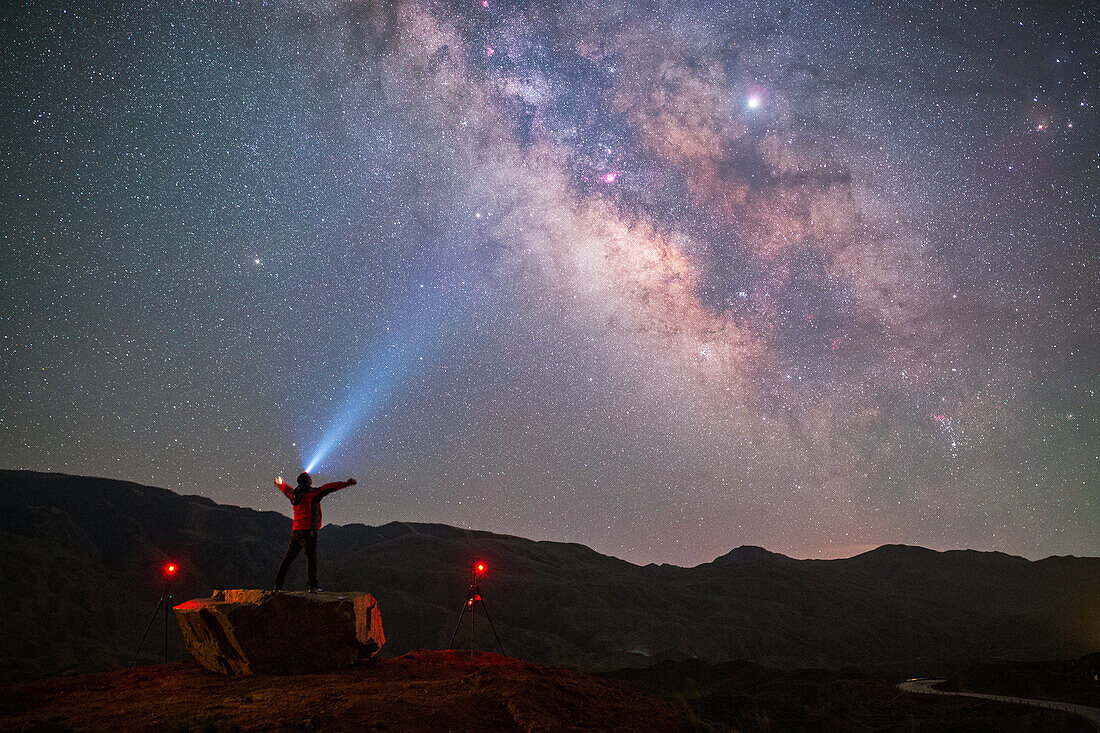 Stargazer looking towards sky, Gansu, China