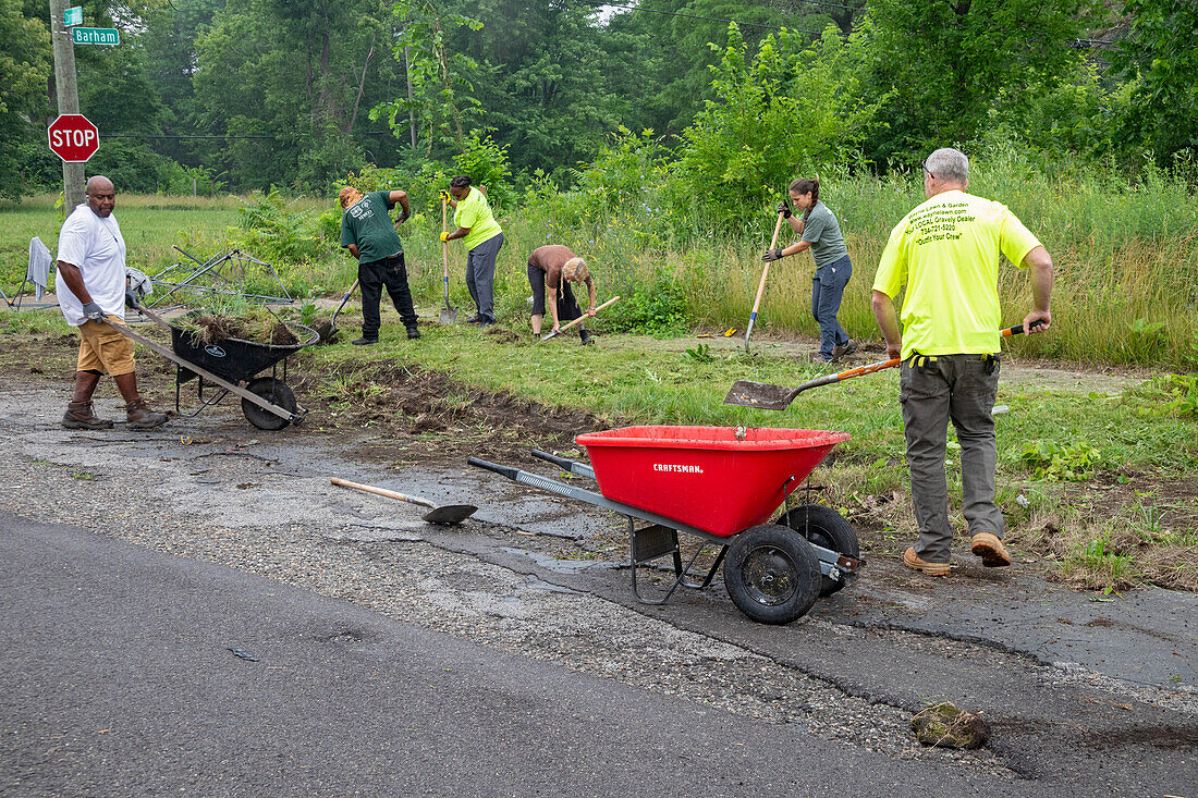 Volunteers clearing ground for roadside garden