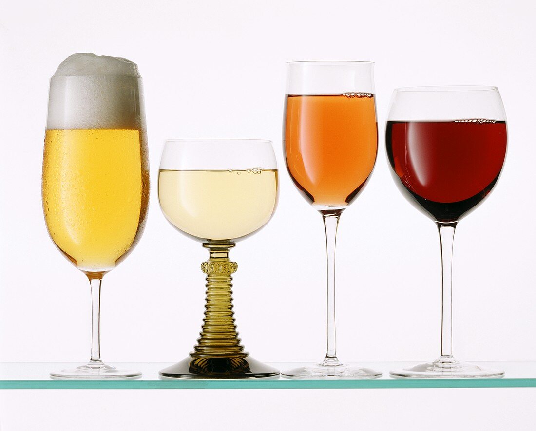 A glass each of beer, white wine,  rose wine and red wine