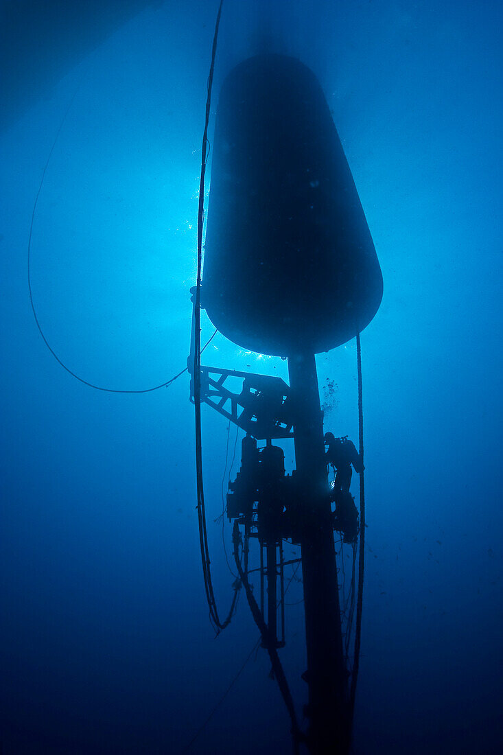 Diver working on wave energy buoy