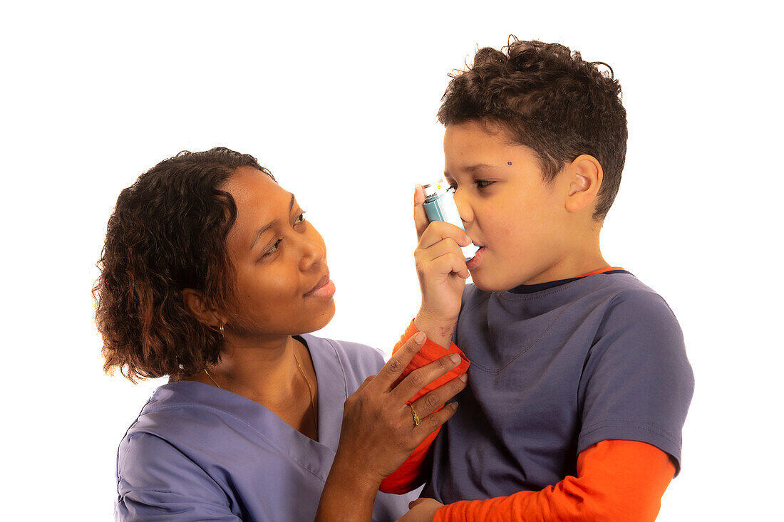 Boy using inhaler