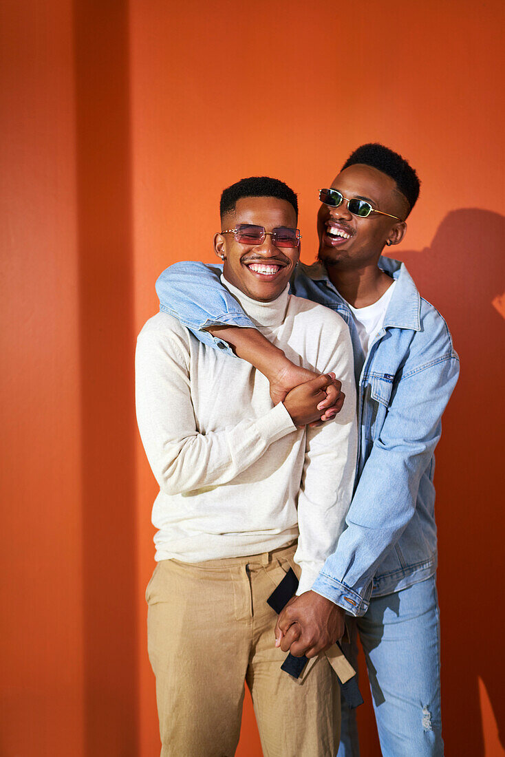 Happy young gay male couple