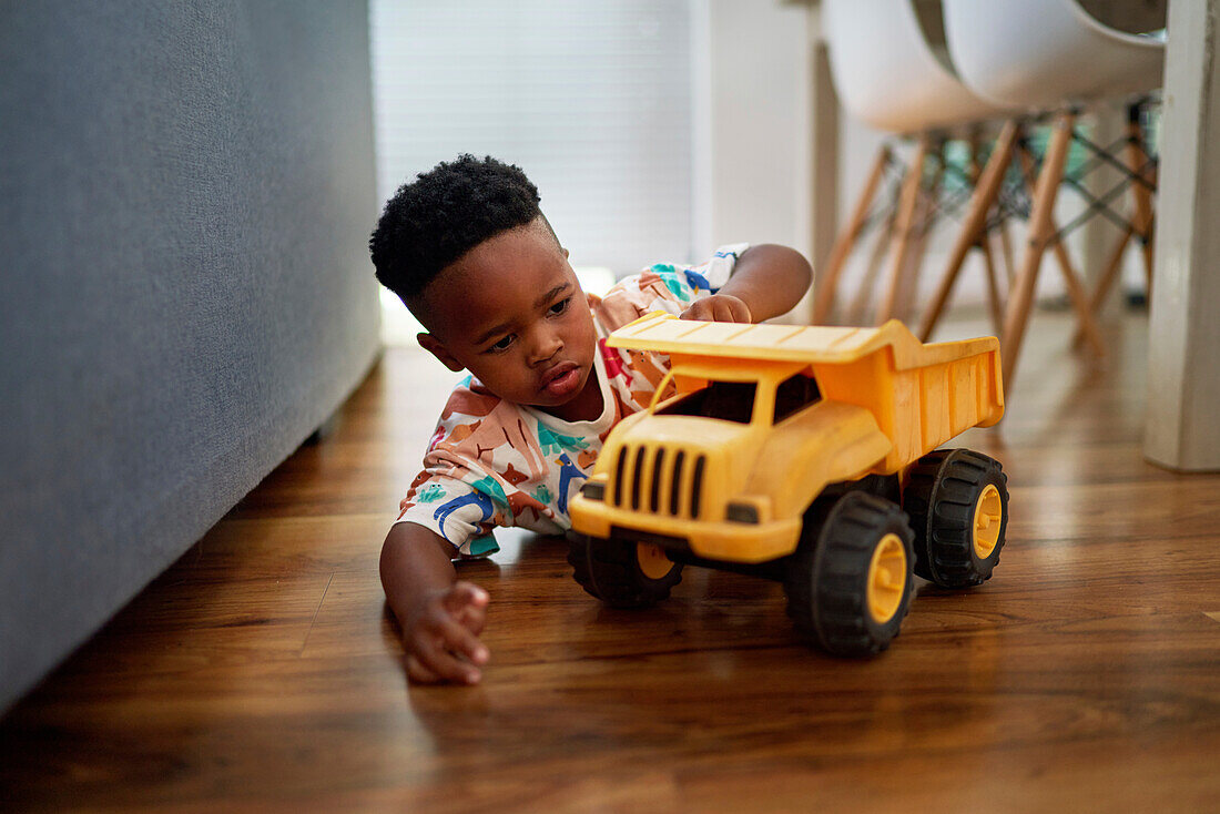 Boy playing with dump truck toy