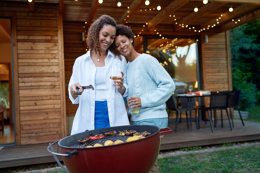 Lesbian couple enjoying barbecue