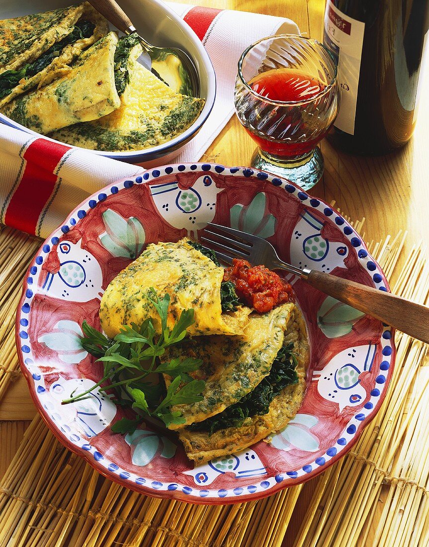 Frittata with spinach on plate and in bowl