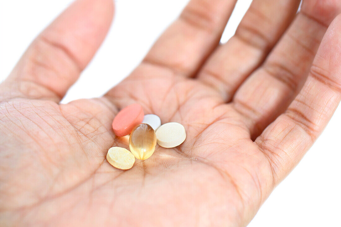 Pills in man's hand