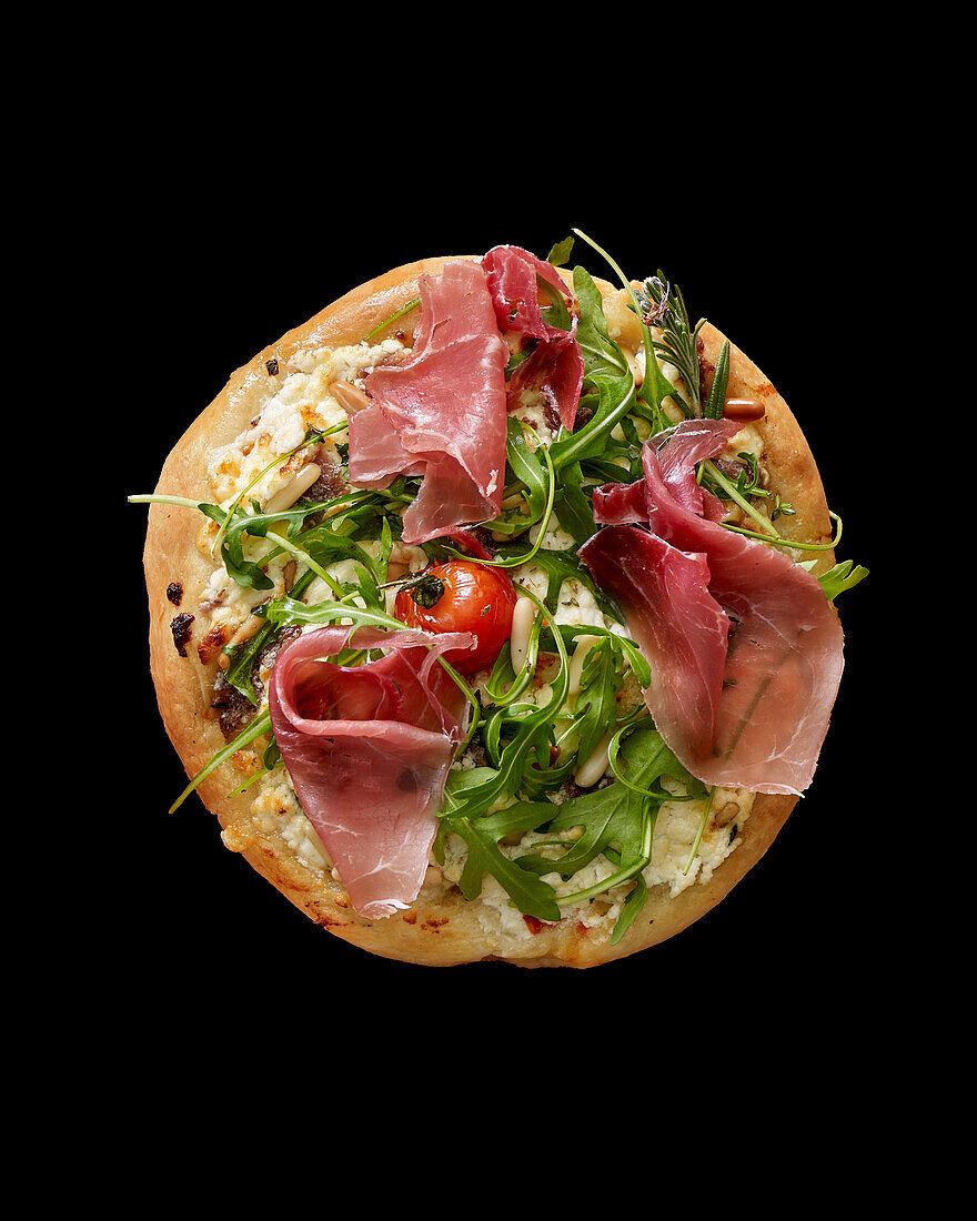 Pizza mit Rucola und Parmaschinken