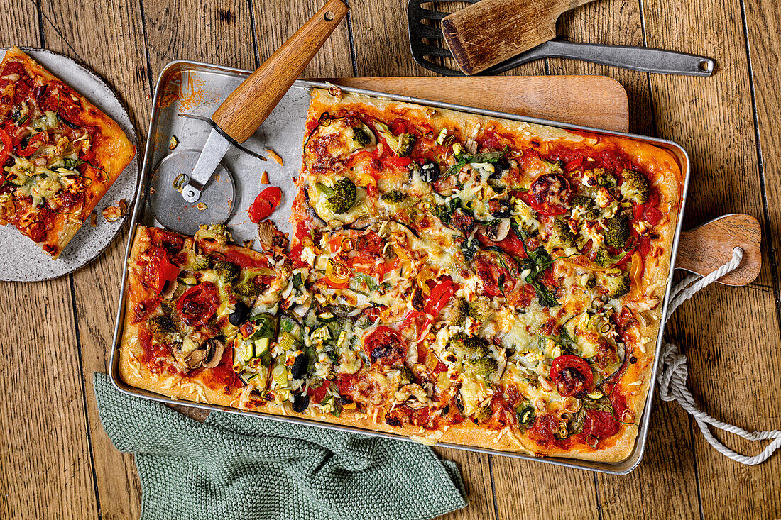 Patchwork pizza with vegetables and feta