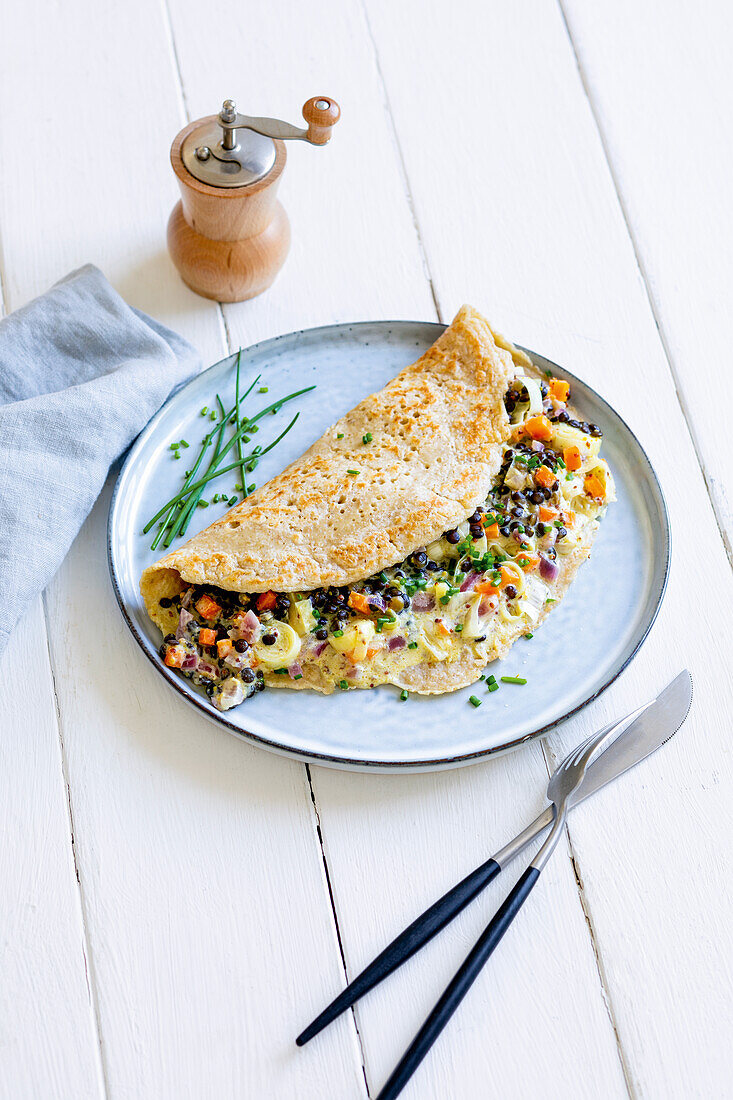 Oat crêpes with beluga lentil vegetables