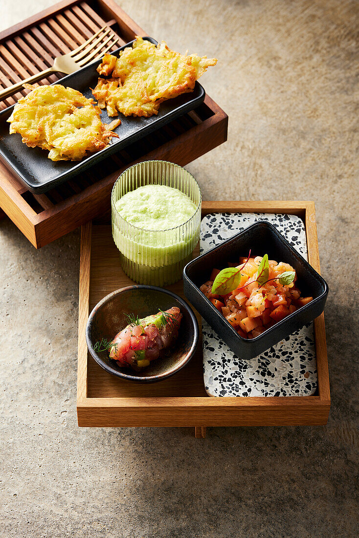 Tuna gnocchi and salmon tartare with cucumber foam