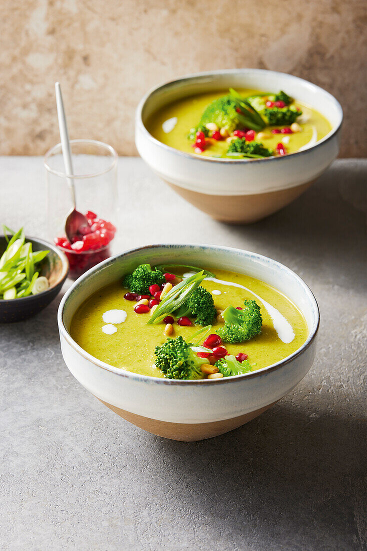 Oriental coconut and broccoli soup with pomegranate topping