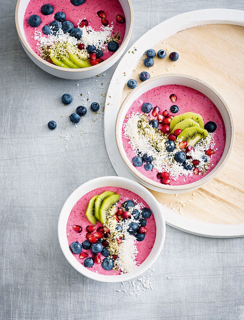 Fruity smoothie bowl with pomegranate seeds and hemp seeds