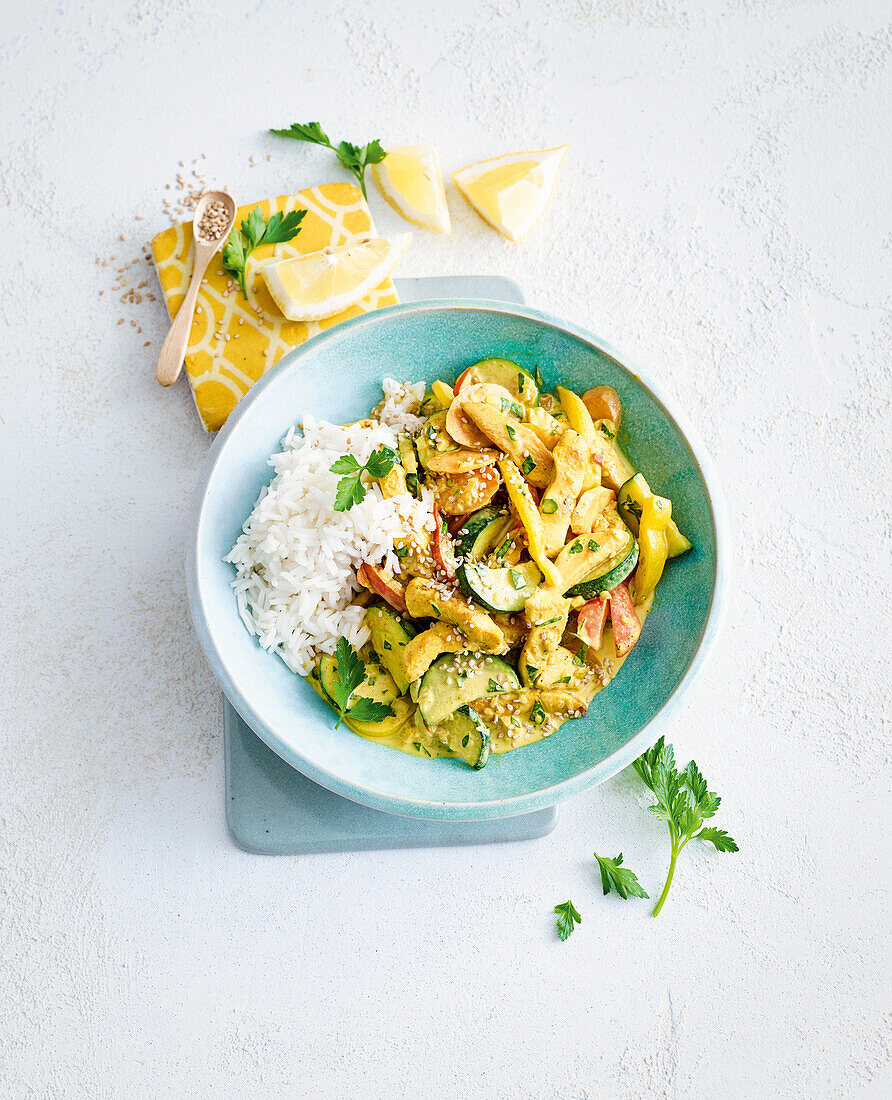 Chicken curry with colourful vegetables and rice