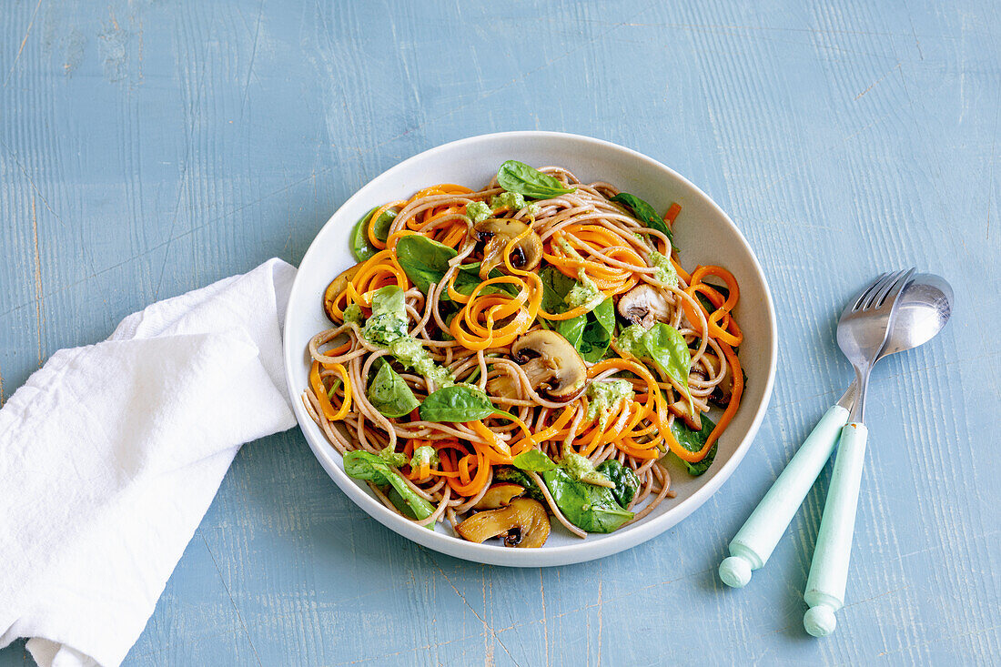 Carrot pasta with spinach and nut pesto