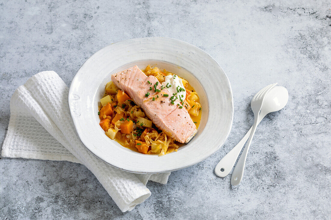 Pumpkin stew with salmon, potatoes and sauerkraut