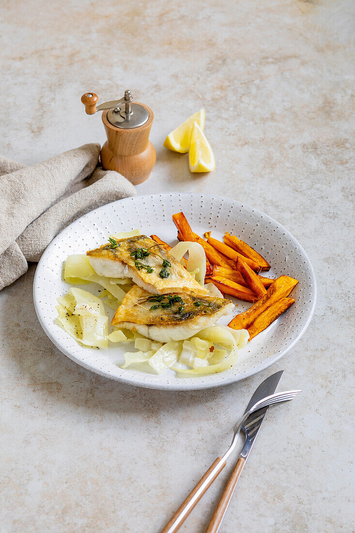 Pikeperch on creamed cabbage with pumpkin sticks