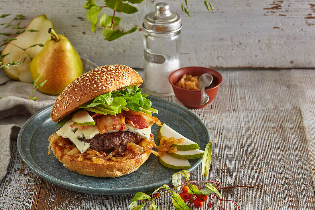 Beef burger with bacon, pear and blue cheese