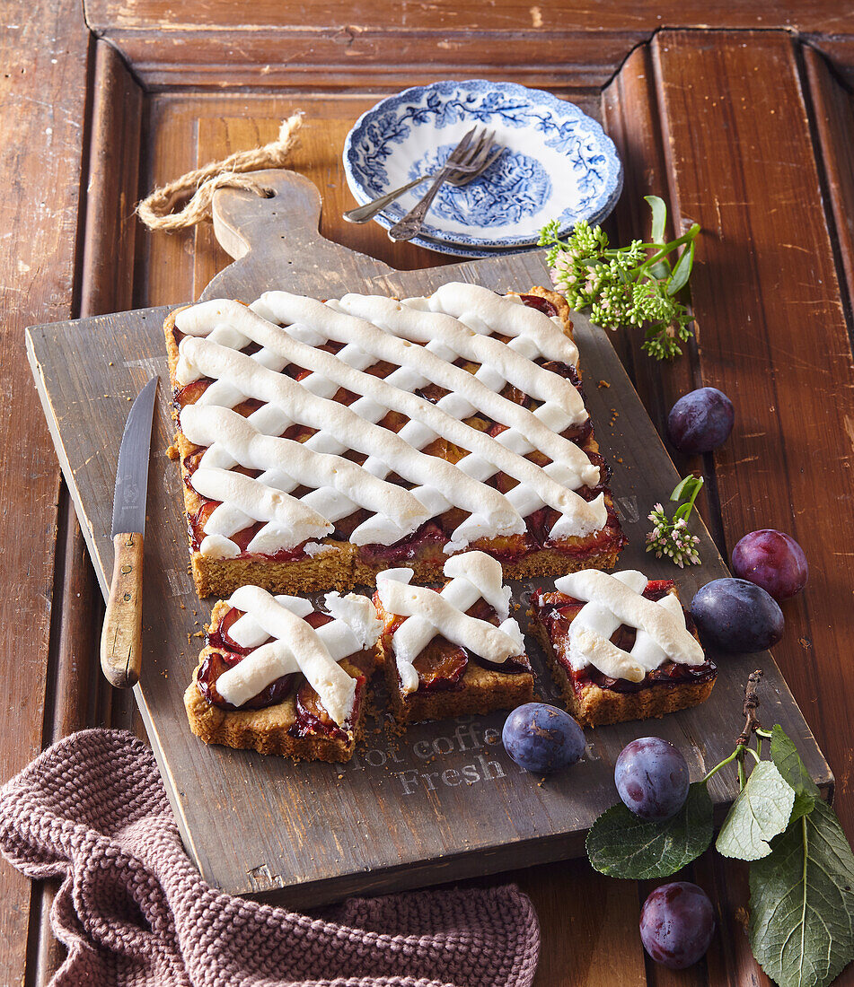 Plum sheet cake with meringue lattice